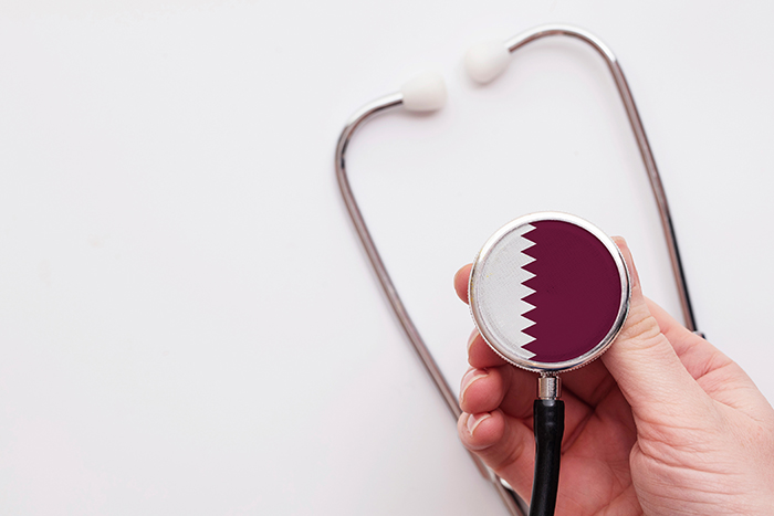 Qatar healthcare concept. Doctor holding a medical stethoscope.